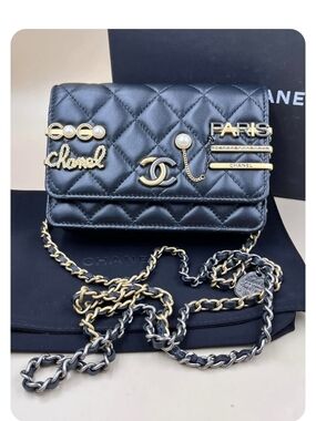 CHANEL Black Quilted Leather Chain Wallet with Gold Accents and Pearl Details
